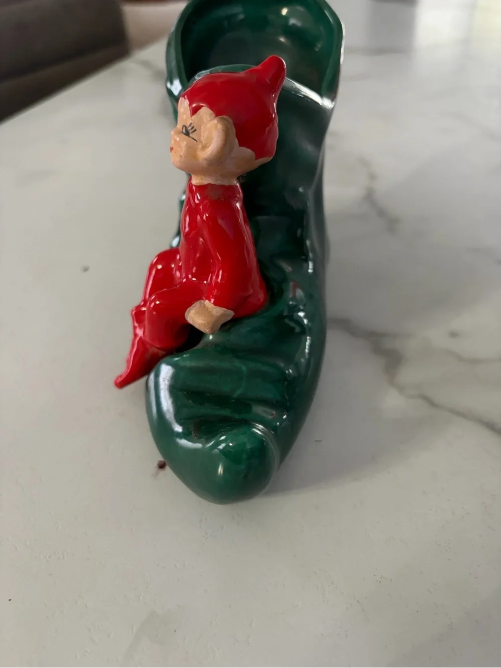 Vintage mid century ceramic pixie elf on a green boot 1950s